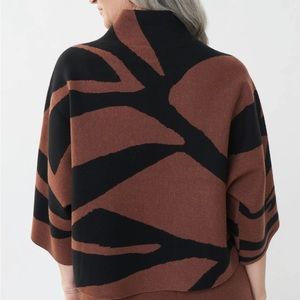 Sweater. Black and toffee in color